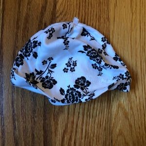 White and black floral print baby hat up to 3 months